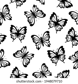 Decorative flying black butterflies with simple elements on a white background. Insects. Seamless doodle summer pattern. Suitable for wallpaper, textile, packaging.