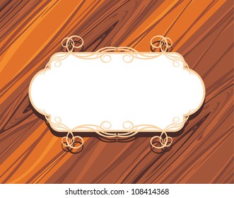 Decorative frame on the wooden background. Vector