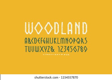 Decorative geometric sans serif font in the style of handmade graphics. Typeface with vintage texture. Letters and numbers for logo and emblem design