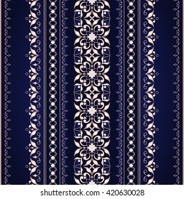 Decorative gold seamless border on a blue. Ornate element for design. Ornamental lace pattern for invitations and greeting cards. Traditional floral decor.