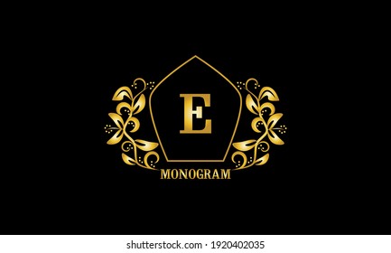 Decorative, golden graceful monogram with initials E. Heraldic logo symbol with exclusive elements of calligraphic design. Vector business sign, identity for hotel, restaurant, jewelry.
