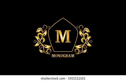 Decorative, golden graceful monogram with initials M. Heraldic logo symbol with exclusive elements of calligraphic design. Vector business sign, identity for hotel, restaurant, jewelry.