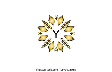 Decorative golden logo with geometric shapes and spikelets on a white background. Creative vector sign, illustration of emblem with letter Y. Eco emblem.