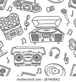 Decorative graphic musical seamless pattern, monochrome endless pattern with tape recorders, microphones, headphones for wallpaper, pattern fills, web page background, textiles. 
