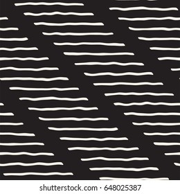 Decorative hand drawn lines seamless pattern. Endless ornament with black ink strokes doodles. Freehand painted stylish background.