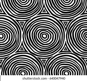 Decorative hand drawn seamless vector pattern. Simple sketchy concentric elements arranged in rows. Ethnic style black and white minimalistic background. Stylized circles.