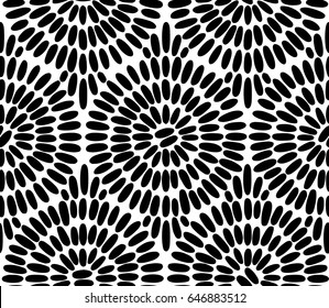 Decorative hand drawn seamless vector pattern. Simple hand drawn sketchy brush strokes arranged in circles. Ethnic style black and white background.