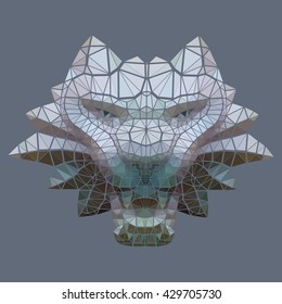 Decorative head of a wild lion. Work is performed in an abstract manner by means of small triangular fragments. 