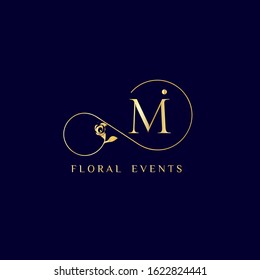 Decorative "Mi" monogram with calla lily. Elegant luxurious logo design for cosmetics and beauty business. Golden color on dark blue background.