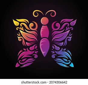 Decorative ornamental butterfly with rainbow gradient colors on a black background. Can be used as a tattoo or tribal symbol or used in different art projects. Print as a silhouette or past sticker 