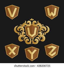 Decorative Ornate emblem template. Stylish set of monograms. Golden shield with crown and letters from U to Z.