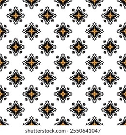 A decorative pattern featuring symmetrical shapes in black and orange on a white background, creating a visually appealing design.