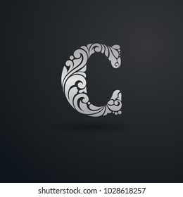 Decorative pattern letter C on black background. Ornate elegant design in Victorian style. For logo, monogram, emblem, initials, business sign, identity, branding.