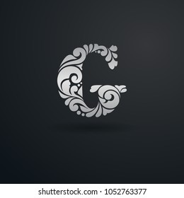 Decorative pattern letter G on black background. Ornate elegant design in Victorian style. For logo, monogram, emblem, initials, business sign, identity, branding.