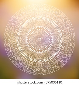 Decorative pattern mandala on blurred background