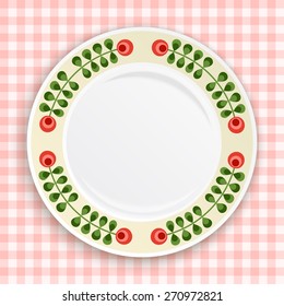 Decorative plate with patterned floral border, on gingham tablecloth. Blank plate,  top view. Vector illustration.