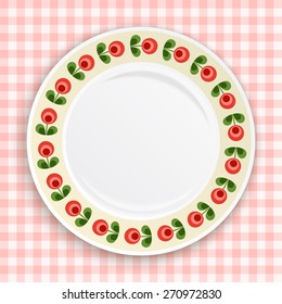 Decorative plate with patterned floral border, on gingham tablecloth. Blank plate, top  view. Vector illustration.