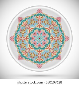 Decorative plate with round ornament in ethnic style. Abstract colored Mandala art, stylized floral pattern. Home decor, interior design, fashion background with colorful ornate dish