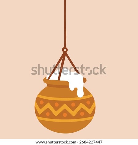 Decorative pot is suspended by a rope, featuring intricate patterns and a white substance, set against a soft pastel background, highlighting cultural artistry