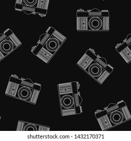 Decorative print with camera on black backdrop. Seamless pattern with randomly arranged line-drawn cameras.