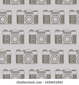Decorative print with line drawn camera on gray backdrop. Seamless pattern with lined up cameras. 