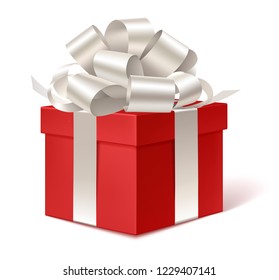 Decorative red gift box with silver bow isolated on white for winter holiday design. Vector illustration
