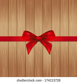 Decorative red ribbon and bow over wooden background. vector