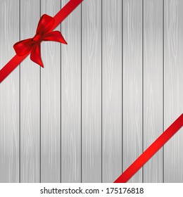 Decorative red ribbon and bow over wooden background. vector 