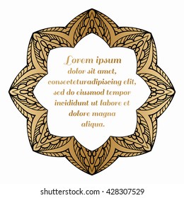 Decorative round element with a black pattern on a gold background.