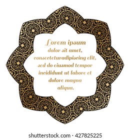 Decorative round element with a gold baroque pattern on a black background.