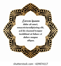 Decorative round element with a gold pattern on a black background.