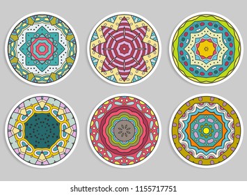 Decorative round ornaments set, isolated elements. Colorful mandala, stylized flower. Abstract geometric doodle patterns for plate decoration, fabric print,  business or greeting card design