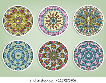 Decorative round ornaments set, isolated elements. Colorful mandala, stylized flower. Abstract geometric doodle patterns for plate decoration, fabric print,  business or greeting card design