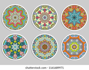 Decorative round ornaments set, isolated elements. Colorful mandala, stylized flower. Abstract geometric doodle patterns for plate decoration, fabric print,  business or greeting card design