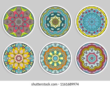 Decorative round ornaments set, isolated elements. Colorful mandala, stylized flower. Abstract geometric doodle patterns for plate decoration, fabric print,  business or greeting card design