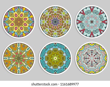 Decorative round ornaments set, isolated elements. Colorful mandala, stylized flower. Abstract geometric doodle patterns for plate decoration, fabric print,  business or greeting card design