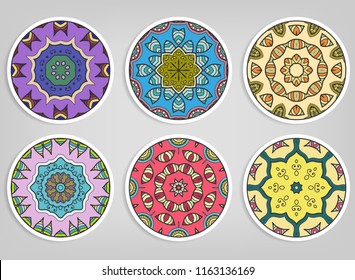 Decorative round ornaments set, isolated elements. Colorful mandala, stylized flower. Abstract geometric doodle patterns for plate decoration, fabric print,  business or greeting card design