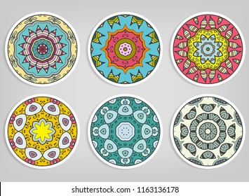 Decorative round ornaments set, isolated elements. Colorful mandala, stylized flower. Abstract geometric doodle patterns for plate decoration, fabric print,  business or greeting card design
