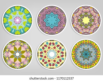Decorative round ornaments set, isolated elements. Colorful mandala, stylized flower. Abstract geometric doodle patterns for plate decoration, fabric print,  business or greeting card design