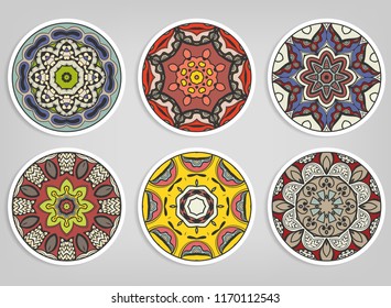 Decorative round ornaments set, isolated elements. Colorful mandala, stylized flower. Abstract geometric doodle patterns for plate decoration, fabric print,  business or greeting card design