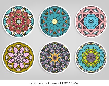 Decorative round ornaments set, isolated elements. Colorful mandala, stylized flower. Abstract geometric doodle patterns for plate decoration, fabric print,  business or greeting card design