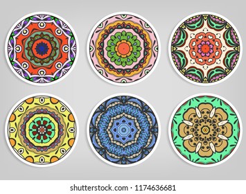 Decorative round ornaments set, isolated elements. Colorful mandala, stylized flower. Abstract geometric doodle patterns for plate decoration, fabric print,  business or greeting card design