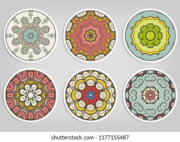 Decorative round ornaments set, isolated elements. Colorful mandala, stylized flower. Abstract geometric doodle patterns for plate decoration, fabric print,  business or greeting card design