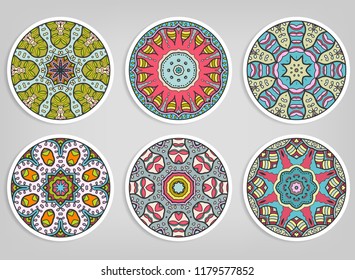 Decorative round ornaments set, isolated elements. Colorful mandala, stylized flower. Abstract geometric doodle patterns for plate decoration, fabric print,  business or greeting card design