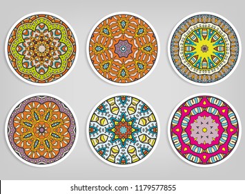 Decorative round ornaments set, isolated elements. Colorful mandala, stylized flower. Abstract geometric doodle patterns for plate decoration, fabric print,  business or greeting card design