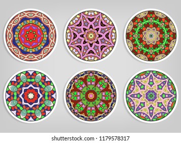 Decorative round ornaments set, isolated elements. Colorful mandala, stylized flower. Abstract geometric doodle patterns for plate decoration, fabric print,  business or greeting card design