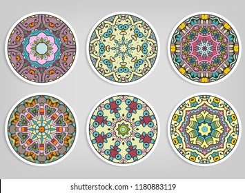 Decorative round ornaments set, isolated elements. Colorful mandala, stylized flower. Abstract geometric doodle patterns for plate decoration, fabric print,  business or greeting card design