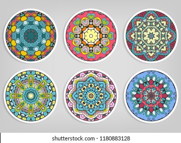 Decorative round ornaments set, isolated elements. Colorful mandala, stylized flower. Abstract geometric doodle patterns for plate decoration, fabric print,  business or greeting card design