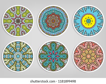 Decorative round ornaments set, isolated elements. Colorful mandala, stylized flower. Abstract geometric doodle patterns for plate decoration, fabric print,  business or greeting card design