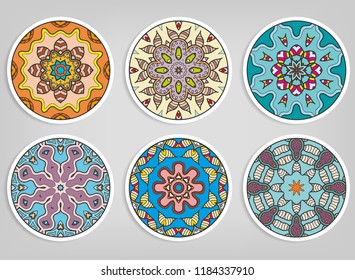 Decorative round ornaments set, isolated elements. Colorful mandala, stylized flower. Abstract geometric doodle patterns for plate decoration, fabric print,  business or greeting card design
